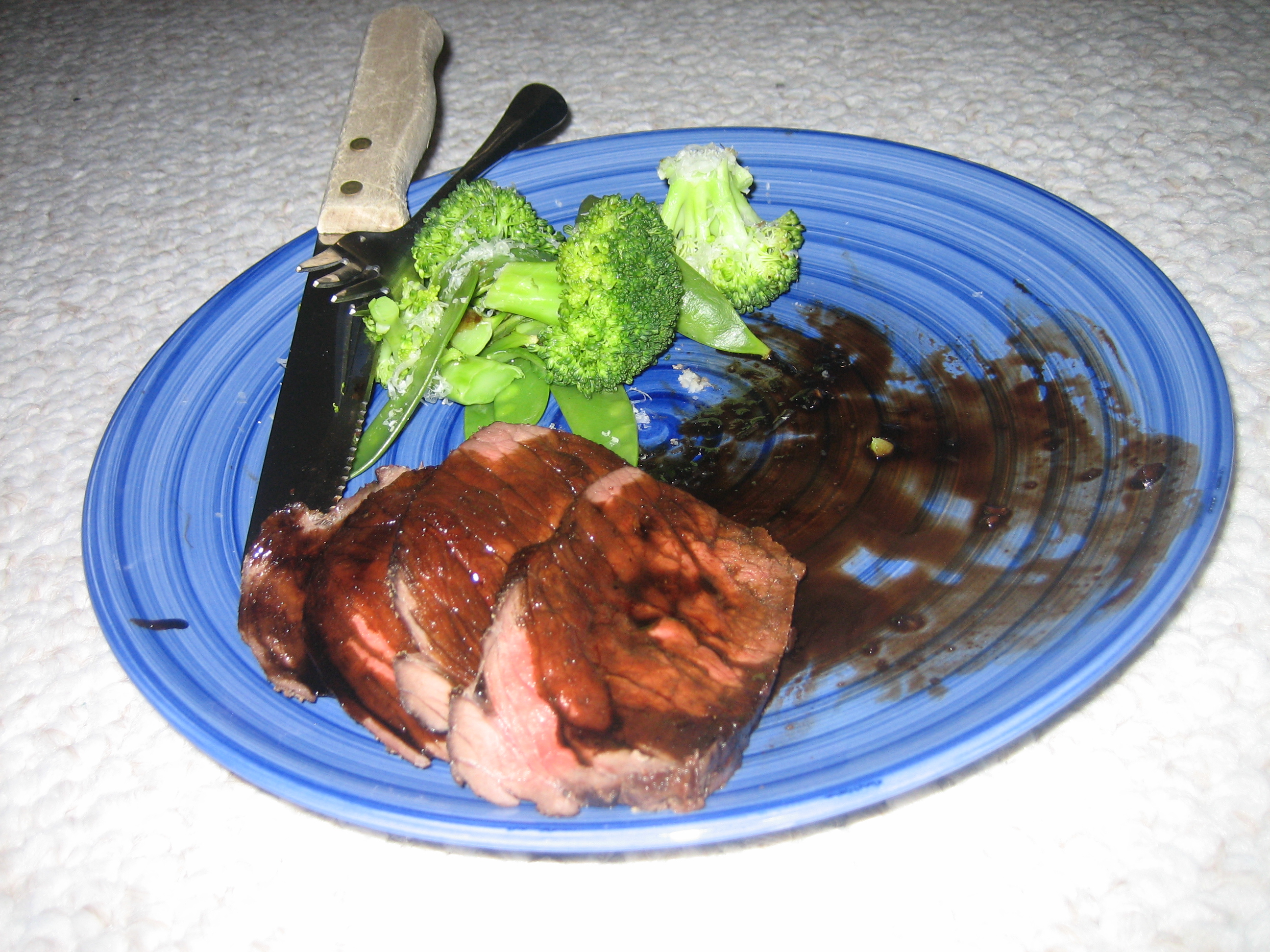 Completely awful photo of roasted buffalo with balsamic sauce. I had already started eating, realized I should take a picture, then realized my camera was out of battery. I charged the battery for ONE MINUTE, which was just enough to take three very hasty shots of this plate. And yes, I was eating on the living room floor that night. We need to move into an apartment that actually has room for a dining table. The end.